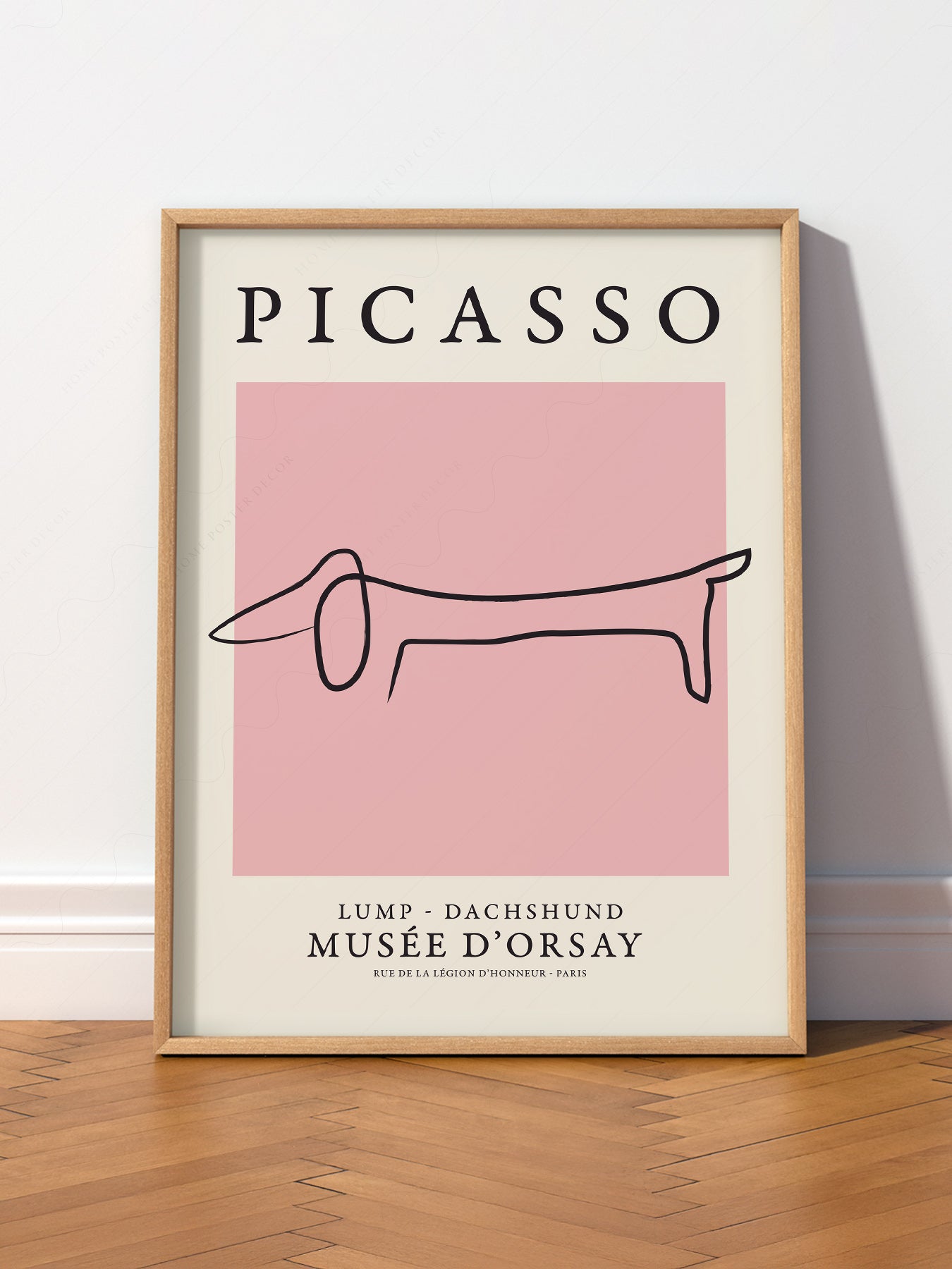 Pablo Picasso Lump Dachshund Line wall art print displayed in a bright modern living room