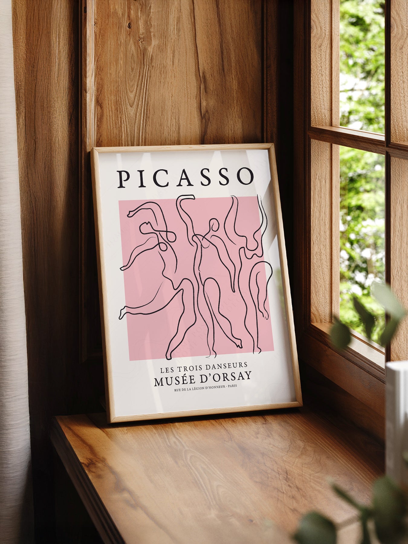 Pablo Picasso Les Trois Danseurs print styled in a mid-century modern dining room