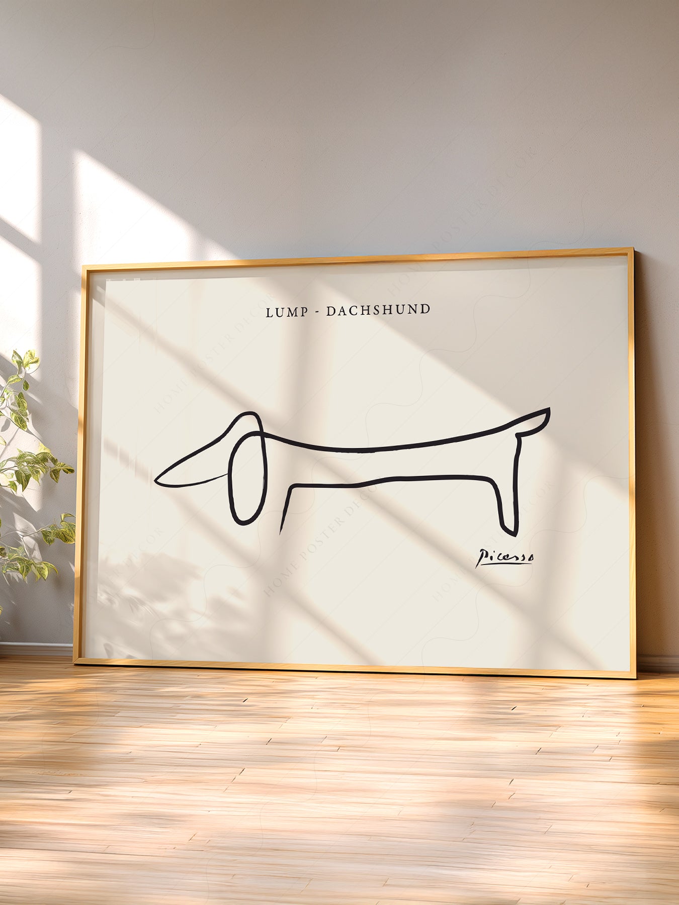 Pablo Picasso Lump Dachshund Line wall art print displayed in a bright modern living room