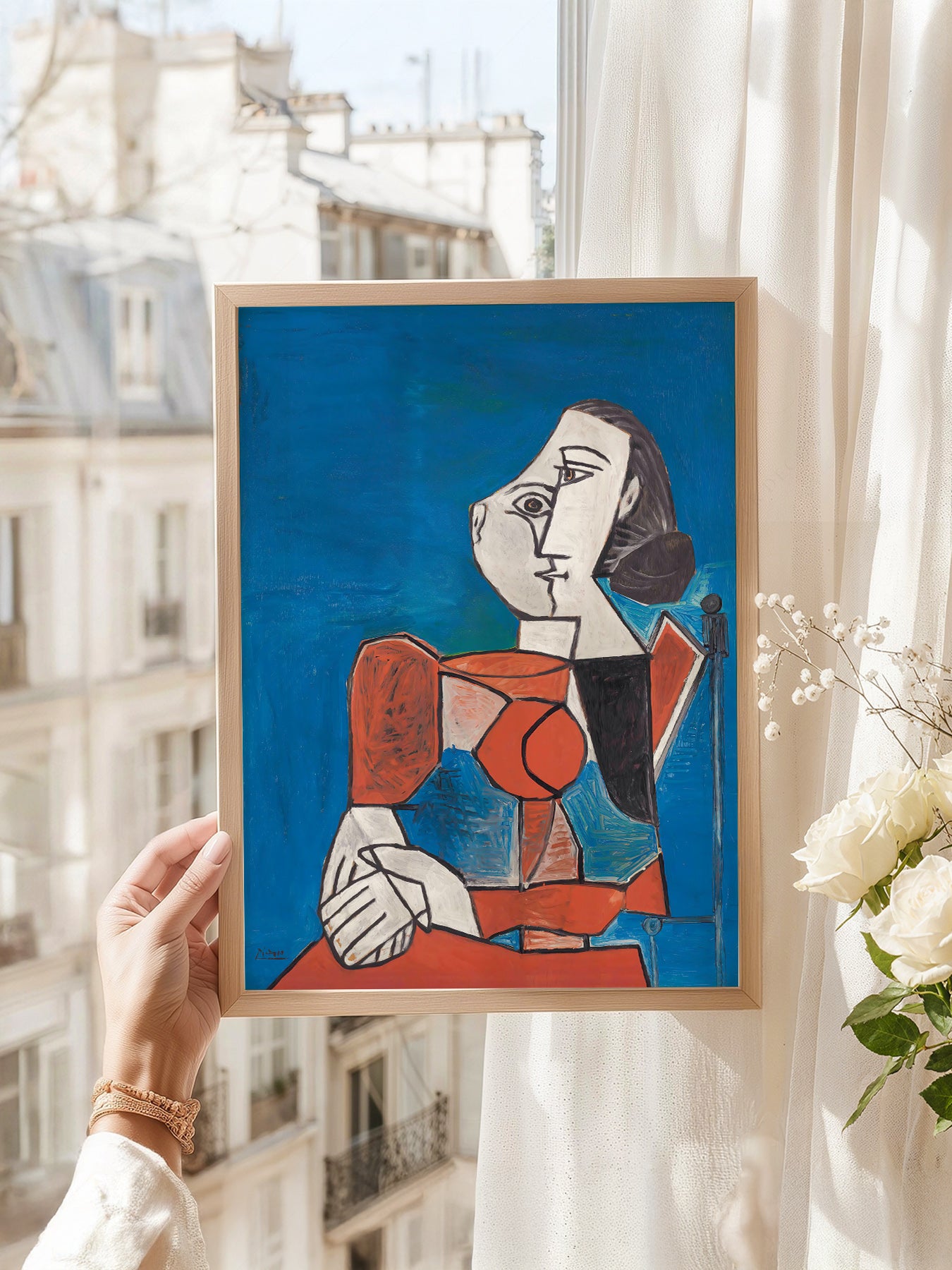 Pablo Picasso art print as wall decor in a minimalist home office
