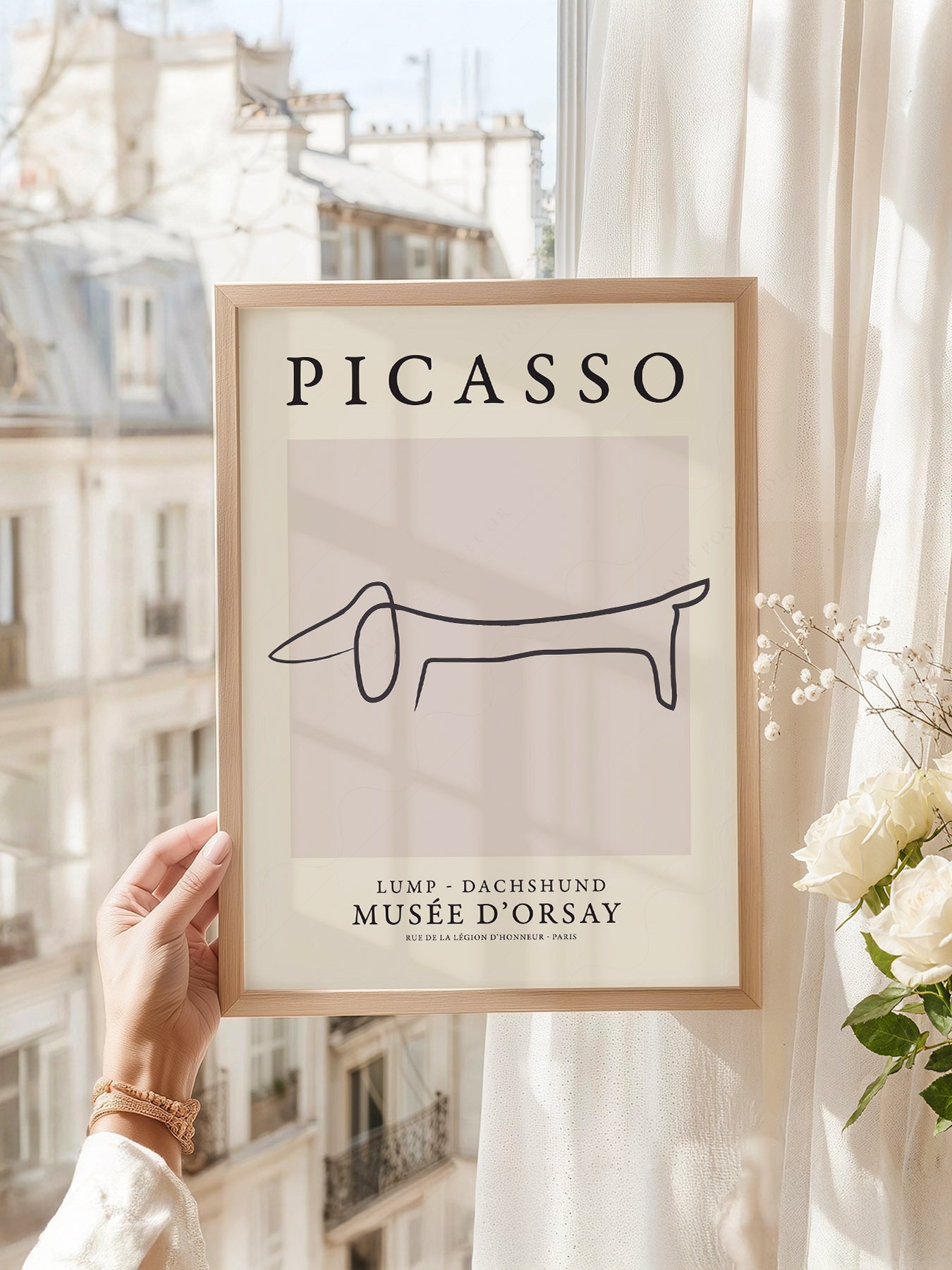 Pablo Picasso art print as wall decor in a minimalist home office
