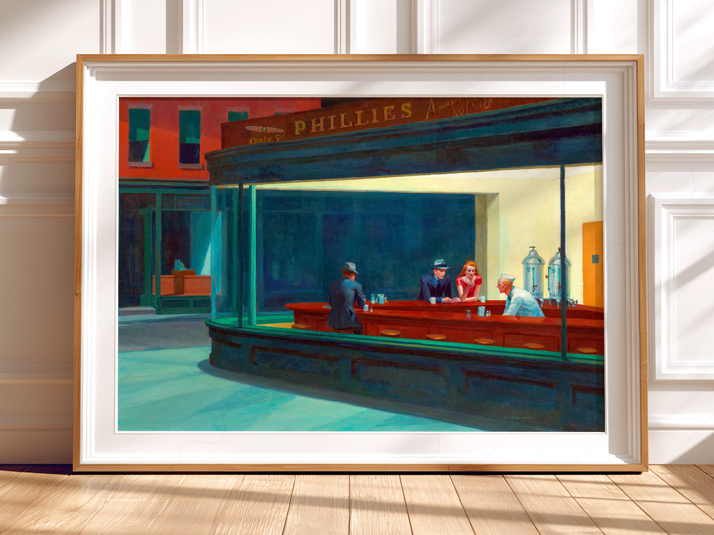 Edward Hopper Nighthawks wall art print displayed in a bright modern living room