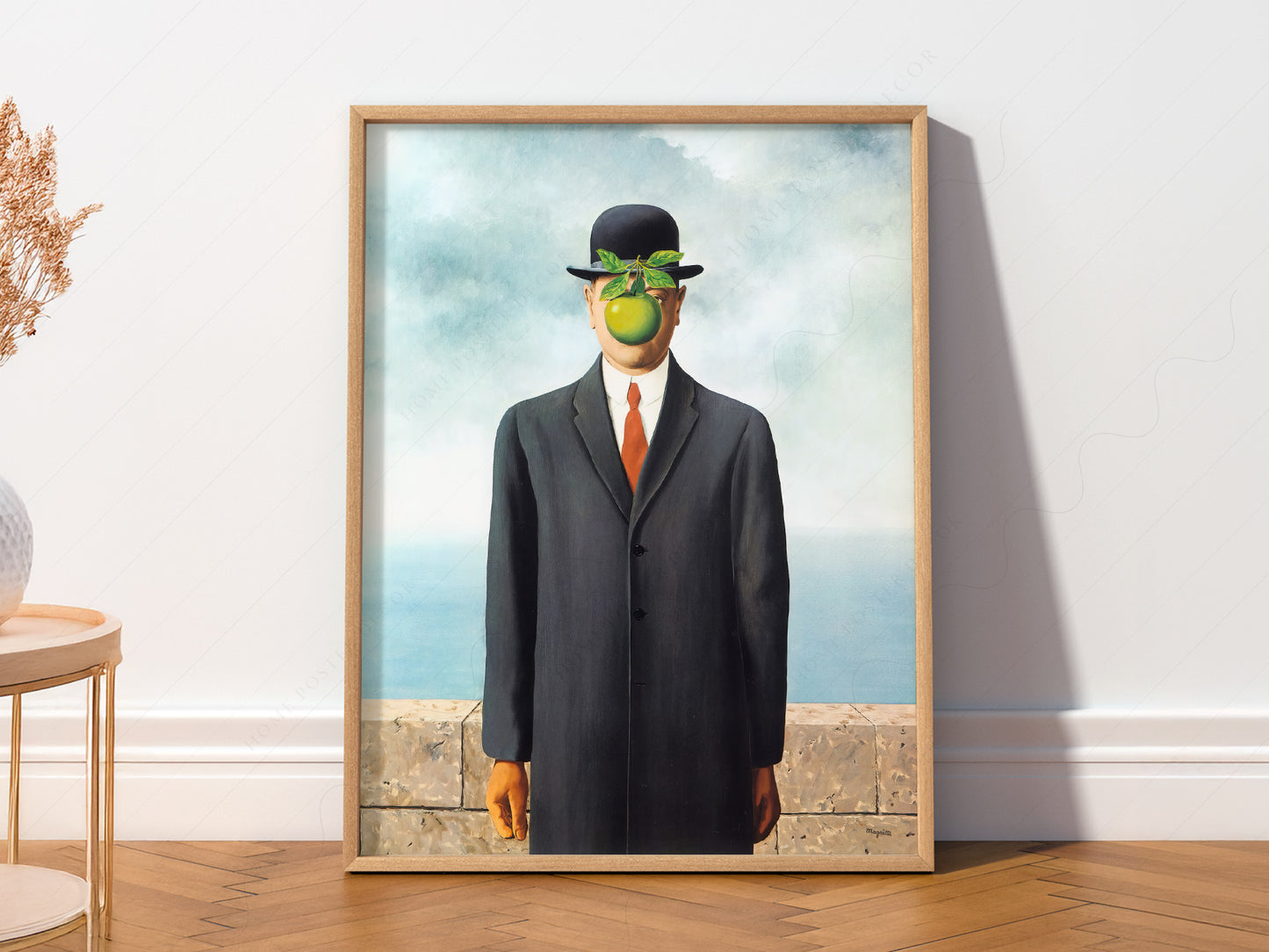 René Magritte art print as wall decor in a minimalist home office