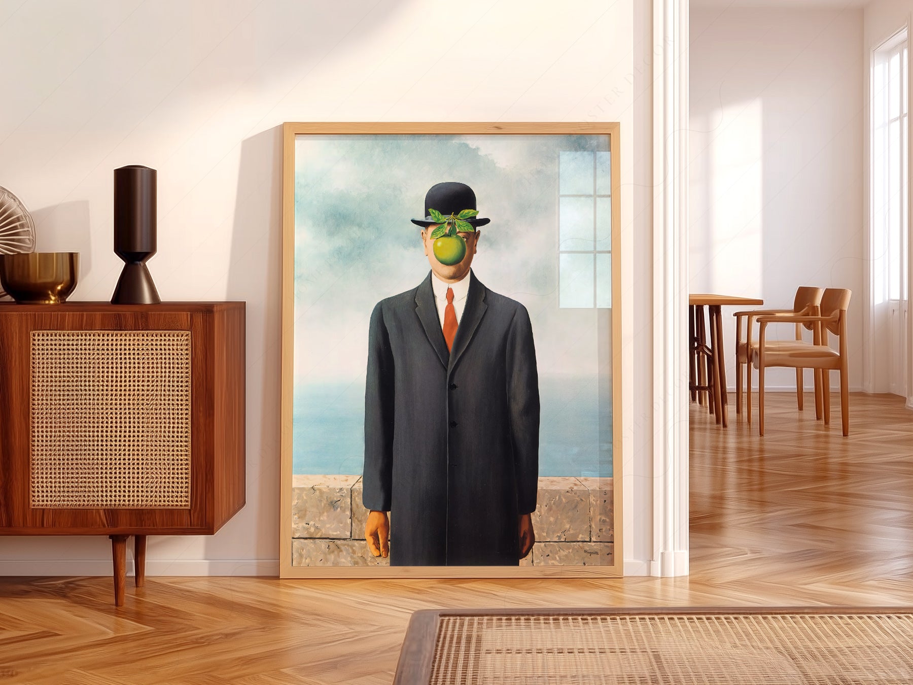 René Magritte The Son of Man wall art print displayed in a bright modern living room