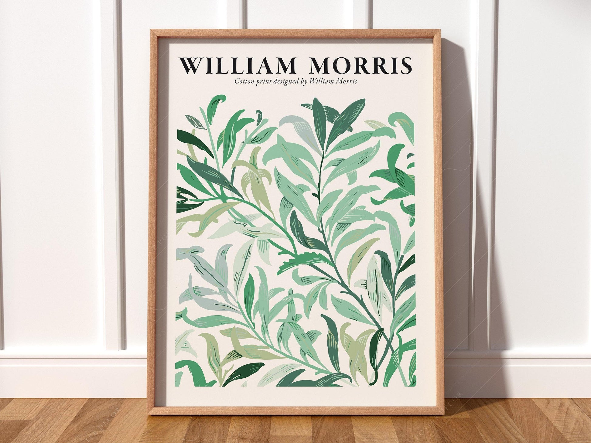 William Morris botanical art print featuring flowing green leaves in varying shades on cream background wall art.