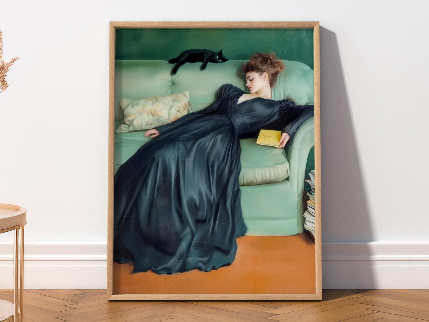 Art Nouveau style wall art print of a woman in dark gown with black cat on emerald green sofa