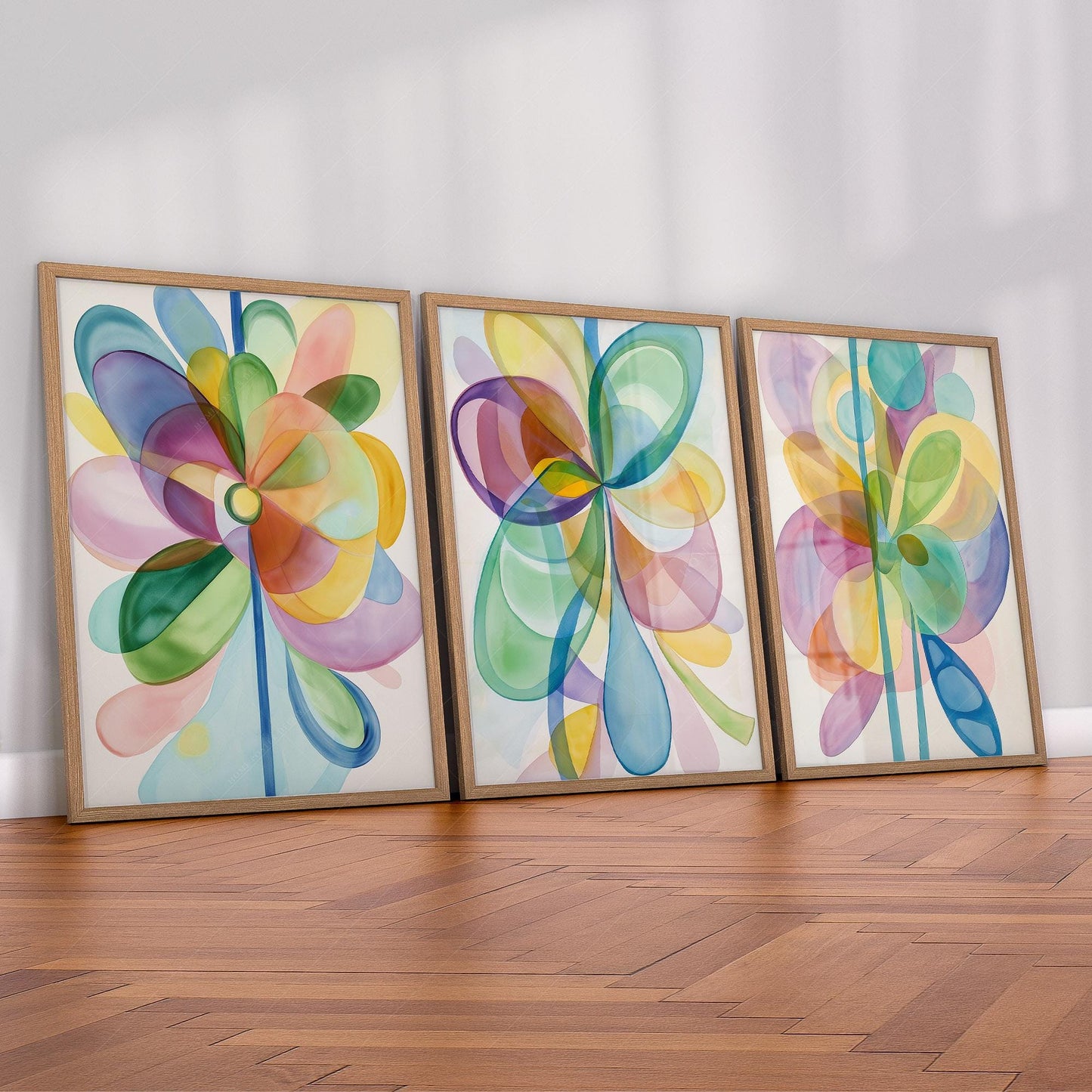 Set of three abstract watercolor flower art prints with colorful overlapping petals as modern wall art.