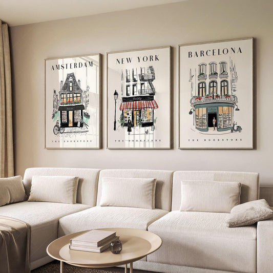 Set of three bookstore art prints featuring Amsterdam, New York, and Barcelona illustrations as wall art.