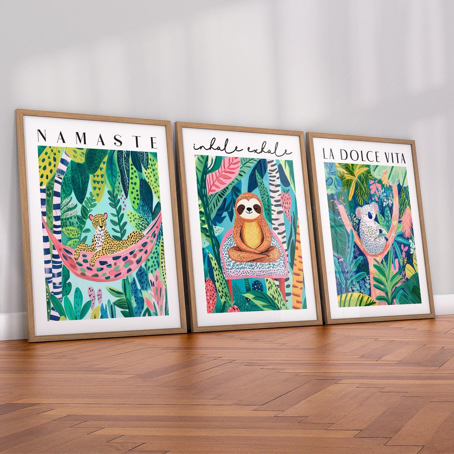 Set of three colorful jungle animal wall art prints featuring leopard, sloth, and koala with inspirational quotes for kids rooms.