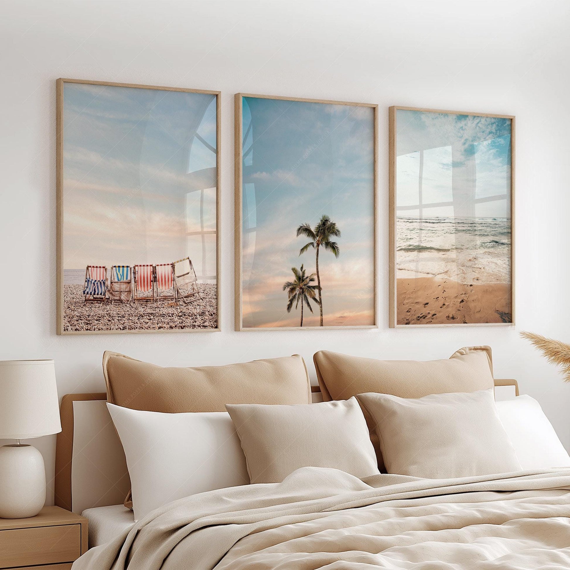 Beach wall art set of three prints featuring colorful deck chairs, palm trees, and ocean waves in a boho bedroom.
