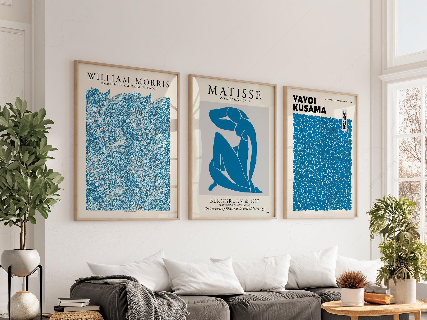 Blue gallery wall art set featuring William Morris, Matisse, and Yayoi Kusama exhibition posters in a modern living room.