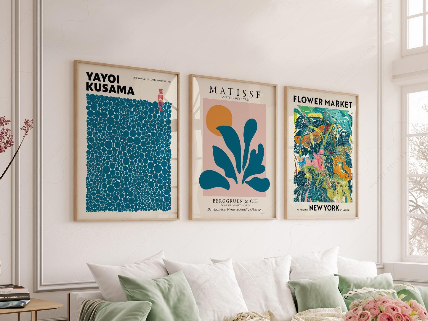 Teal gallery wall art print set featuring Yayoi Kusama, Matisse cut-out, and Flower Market New York posters above a sofa.