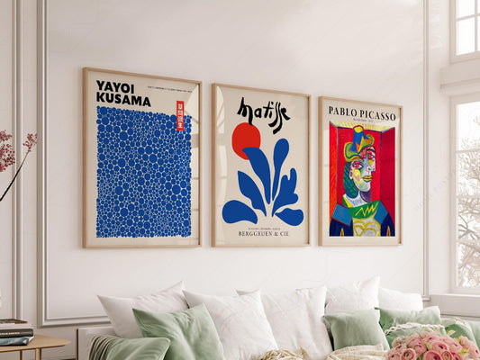 Gallery wall set featuring Yayoi Kusama, Henri Matisse, and Pablo Picasso museum art prints in a modern living room
