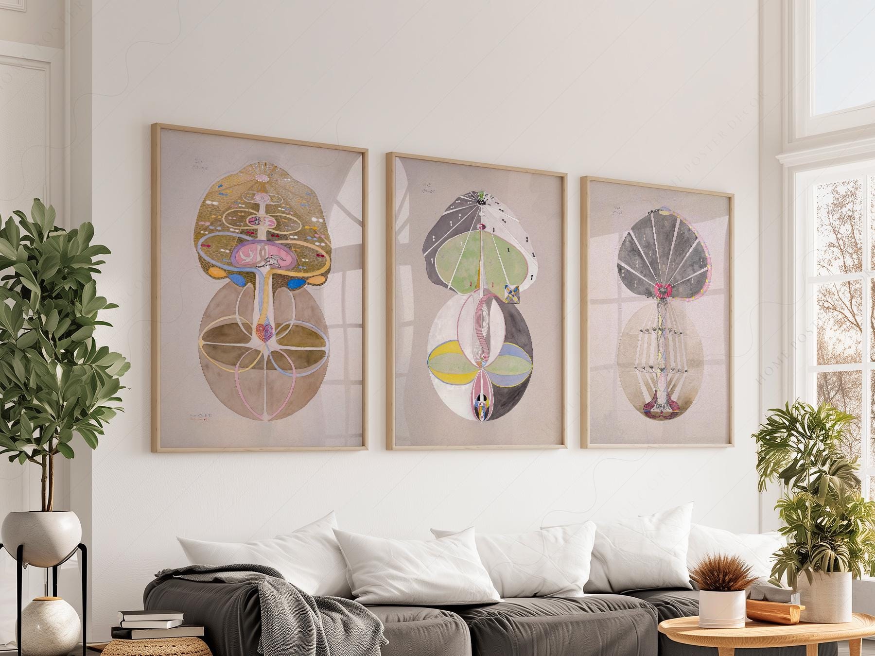 Hilma af Klint The Ten Largest set of three abstract mystical art prints displayed as wall art above a sofa.
