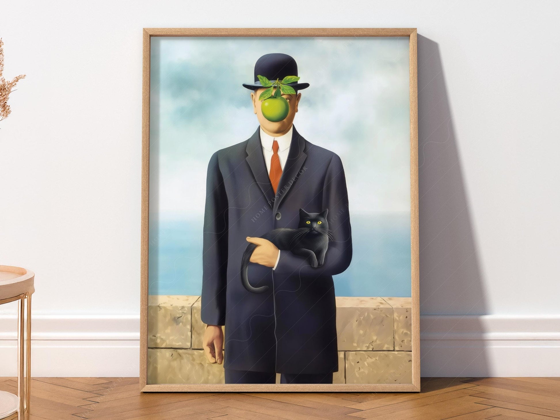 Magritte Son of Man parody art print featuring a suited man with green apple face holding a black cat wall art.