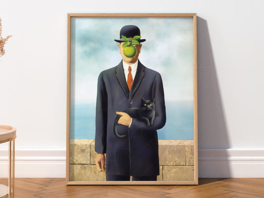 Magritte Son of Man parody art print featuring a suited man with green apple face holding a black cat wall art.