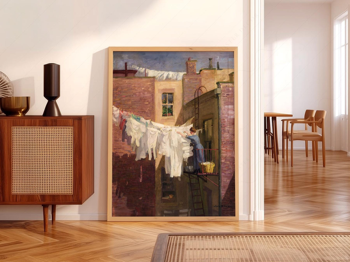 John Sloan A Woman's Work art print featuring a woman hanging laundry on a New York rooftop wall art.