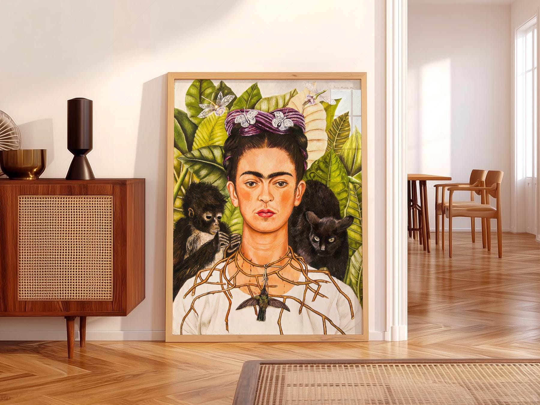 Frida Kahlo Self-Portrait with Thorn Necklace and Hummingbird art print featuring monkey and tropical leaves.
