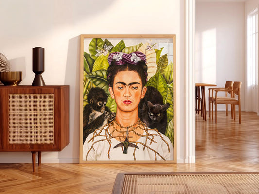 Frida Kahlo Self-Portrait with Thorn Necklace and Hummingbird art print featuring monkey and tropical leaves.