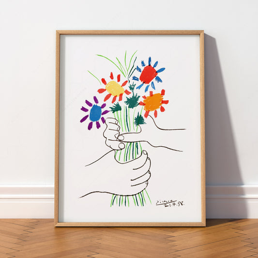 Pablo Picasso The Flowers of Peace wall art print featuring hands holding a colorful bouquet in simple line style.