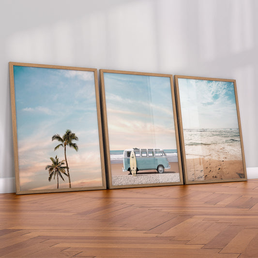 Set of 3 beach art prints featuring palm trees, turquoise vintage VW van with surfboard, and ocean waves wall art.